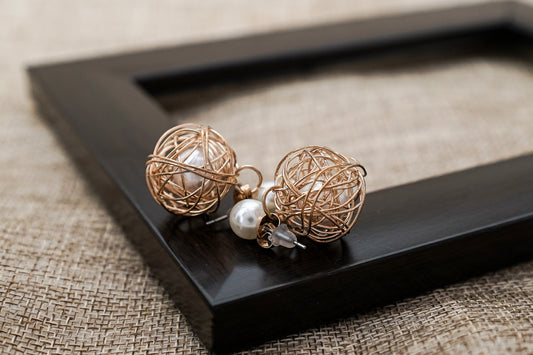 Stylish Korean Earring of Pearl encased in a Golden wire